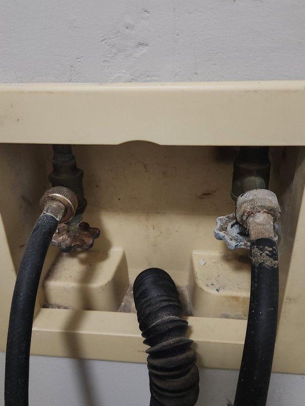 Responded to service call for washing machine installation issue. Upon arrival, found existing washing machine shut-off valves were corroded and inoperable due to age, preventing proper closure and safe appliance connection. Successfully replaced both hot and cold water supply valves with new quarter-turn shut-off valves featuring cross-handle controls. Installed new braided stainless steel flexible supply lines to ensure secure connections. Tested all connections for proper operation and verified no leaks present. System now fully functional and ready for washing machine hookup.