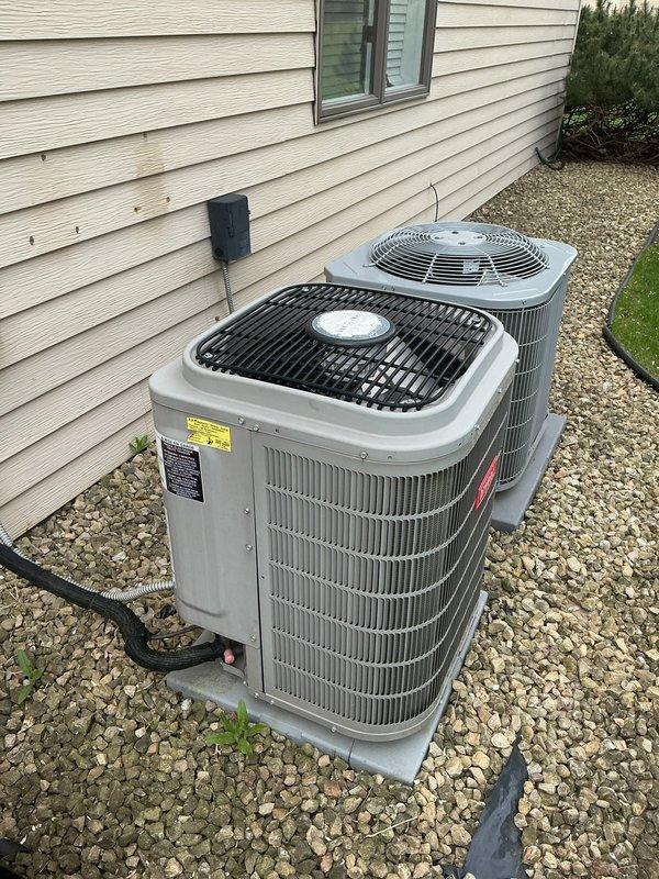 Arrived on-site to perform annual air conditioning tune-up as part of maintenance agreement. Upon inspection of the dual outdoor condenser units and indoor furnace system, determined that outdoor ambient temperature sensors were preventing system operation due to low outdoor temperatures. Unable to complete preventive maintenance procedures as equipment safety controls require minimum 65-degree outdoor temperature for proper system evaluation and testing. Coordinated with dispatch to reschedule service appointment for warmer weather conditions when full tune-up protocol can be safely executed.