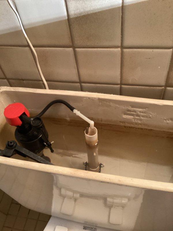 Responded to ongoing slow drain issues in kitchen and bathroom. Upon arrival, kitchen drain was functioning properly with no backup observed. Cleared clogged lavatory drain to restore proper drainage. Replaced malfunctioning toilet fill valve that was sticking and causing improper tank filling. Installed new supply line during fill valve replacement. All fixtures tested and operating correctly upon completion.