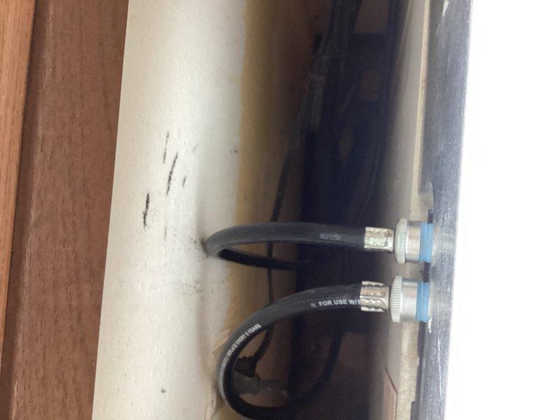 Replaced failing washing machine water supply valve and installed two new washing machine hoses to prevent potential leaking and ensure proper water flow and drainage. Work required accessing closed wall space to complete installation of new valve and secure connections with appropriate hose clamps. All components properly installed and tested for proper operation.