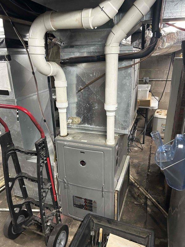 Completed comprehensive HVAC maintenance including safety inspection of furnace system, make-up air system tune-up, and exhaust fan service. Performed routine maintenance on both mini-split and standard split system units, replacing air filters and inspecting evaporator and condenser coils for debris blockage—both found to be in clean condition. Tested blower capacitor, which measured within acceptable parameters. Conducted exterior condenser coil cleaning and verified all electrical components operating to manufacturer specifications. Measured refrigerant pressures and temperatures; system appears adequately charged based on current readings, though ambient conditions limited full AC performance testing. Identified need for furnace air filter replacement requiring special order; return visit scheduled to complete equipment cleaning and filter installation once parts arrive.