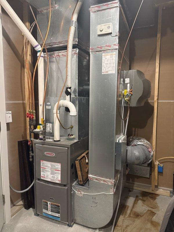 Performed comprehensive AC tune-up on 5-year-old Lennox system that had not been serviced in five years. Conducted thorough inspection of all HVAC components including furnace, air handler, and ductwork. Inspected return air vent previously reported to have moisture concerns and rust/warping on vent cover; found no active water intrusion or moisture present at time of service. Deep cleaned outdoor condensing unit, removing accumulated cottonwood debris and dust buildup from coils and components. Verified all electrical connections, blower operation, and accessible system components functioning properly. Due to ambient outdoor temperature of 41°F, refrigerant levels could not be accurately tested or assessed. All accessible ductwork and venting connections inspected and found secure with no visible issues. System operational and performing as expected under current conditions.