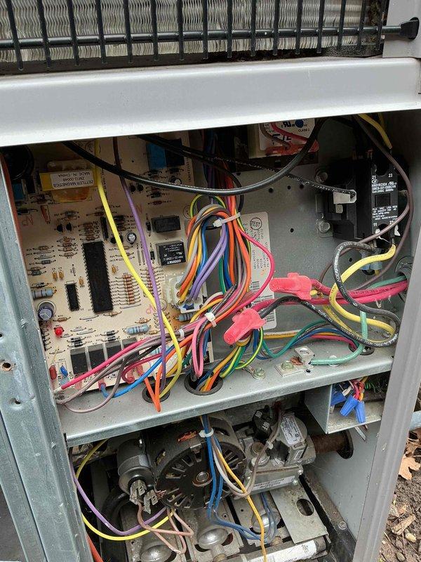 Completed annual air conditioning tune-up and system inspection on residential HVAC unit. Accessed interior components including control board, capacitor, and motor assembly to verify proper operation. Inspected outdoor condenser units, fan assemblies, and coil condition. System tested and confirmed operational with all components functioning within normal parameters.