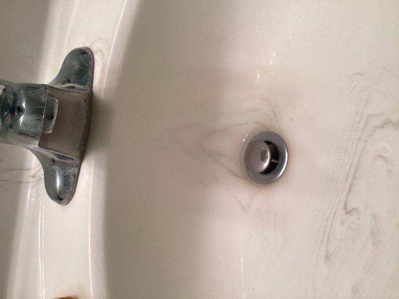 Responded to a water leak located underneath the bathroom sink. Upon inspection, identified the lavatory drain linkage as the source of the leak. Removed the failed drain assembly and installed a new lavatory drain, resolving the leak issue. Verified proper operation and confirmed no further water discharge from the fixture.