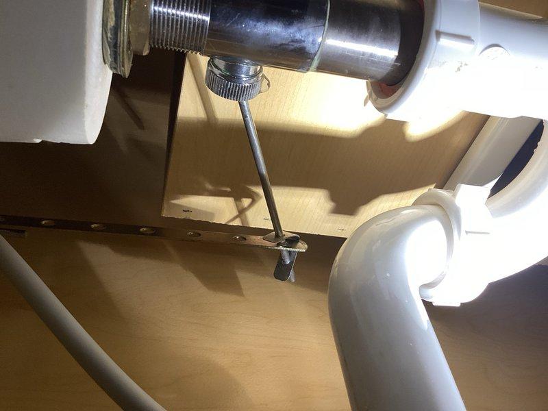 Responded to a water leak located underneath the bathroom sink. Upon inspection, identified the lavatory drain linkage as the source of the leak. Removed the failed drain assembly and installed a new lavatory drain, resolving the leak issue. Verified proper operation and confirmed no further water discharge from the fixture.