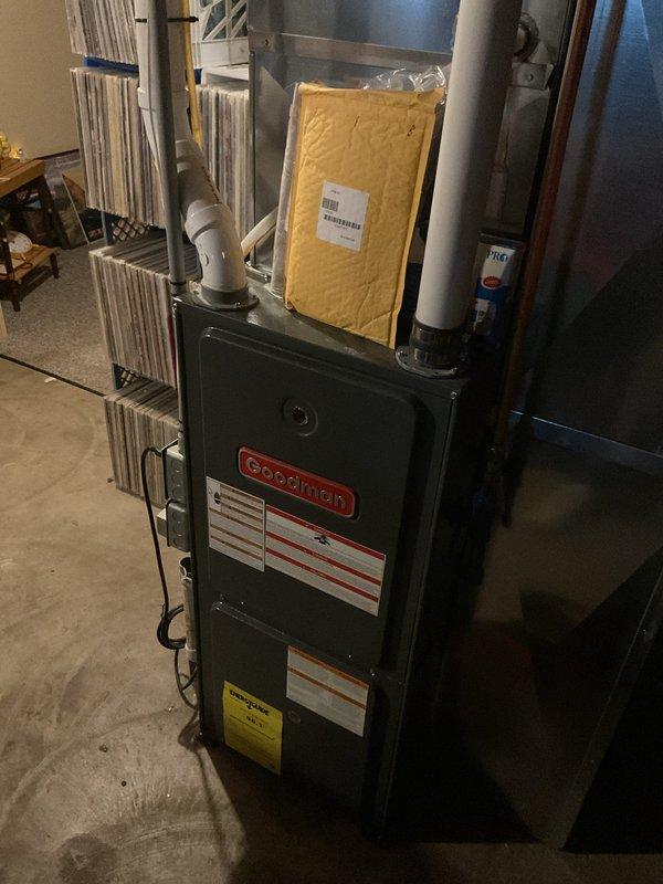 Responded to no heat call on 10-year-old Goodman furnace affecting entire residence. Upon inspection, identified dirty flame sensor preventing ignition cycle from completing. Cleaned flame sensor rod to restore proper flame rectification signal. Performed complete system tune-up including filter inspection, blower compartment cleaning, and verification of proper airflow through heat exchanger and evaporator coil. Tested all safety controls and confirmed furnace returned to normal heating operation with proper burner ignition and flame sensing.