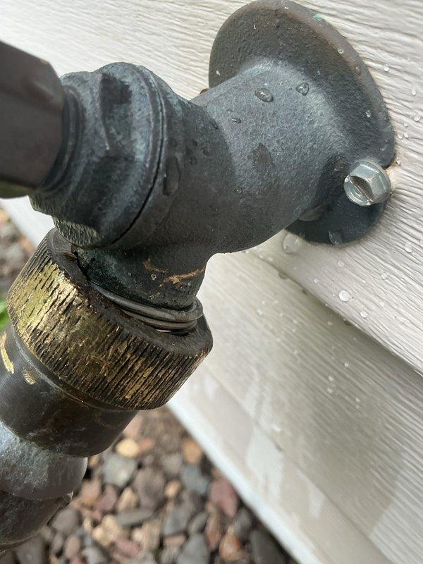 Responded to outdoor water spigot leak caused by stripped backflow preventer and cross-threaded connections. Removed deteriorated fixture showing significant corrosion, worn brass threading, and mineral buildup from prolonged outdoor exposure. Installed new Woodford frost-free hose bib with proper threading and connections to eliminate leak and restore functionality to exterior water access point.