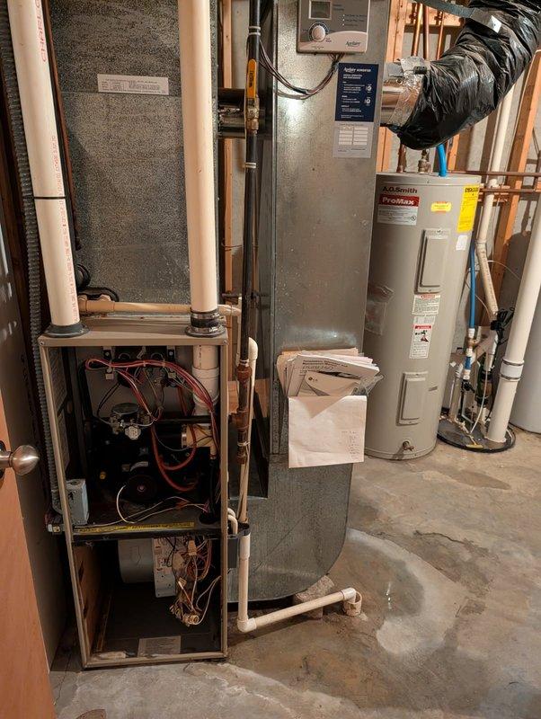 Responded to service call for furnace leaking water on 6-year-old unit. Upon inspection, identified failed condensate collector box as source of water leak. Removed defective collector box and installed replacement unit. Verified proper drainage through condensate system, confirmed no additional leaks, and tested furnace operation to ensure proper functionality.