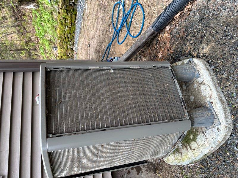 Completed Family Rewards cooling maintenance visit on heat pump system. Upon inspection, found condenser coil heavily soiled with accumulated dirt and debris, which was thoroughly cleaned to restore proper airflow and efficiency. Discovered kinked condensate drain line from evaporator coil causing potential drainage issues; removed damaged section and installed barbed 90-degree fitting to ensure proper condensate flow. Replaced air filter and performed standard heat pump operational checks. System tested and verified operating within normal parameters at 42° outdoor ambient temperature.
