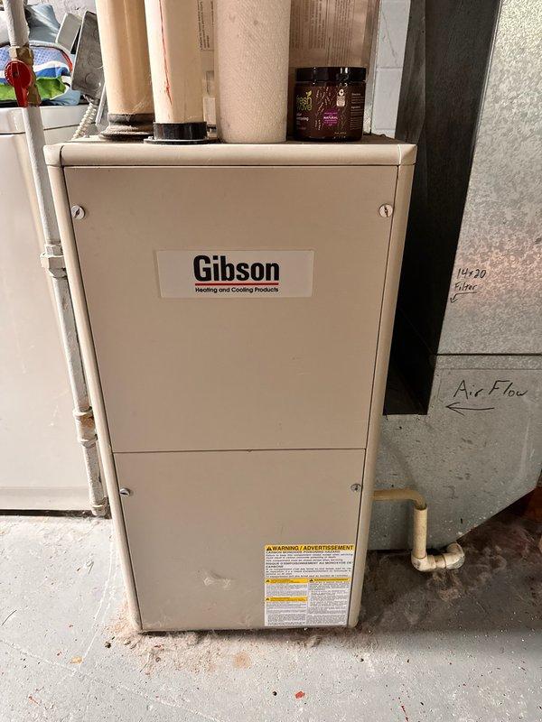 Responded to no heat call on Gibson natural gas furnace. Upon arrival, homeowner reported unit would run for only a couple minutes before shutting down and required toggling power switch to restart after extended idle periods. Initiated system startup and observed igniter failing to achieve proper glow intensity during ignition sequence. Electrical testing confirmed igniter was weak and operating below specifications. Visual inspection revealed component in deteriorated condition. Performed comprehensive system evaluation and found air filter completely plugged, restricting airflow. All other furnace components including blower motor, flame sensor, gas valve, and limit switches tested within normal operating parameters. Replaced failed hot surface igniter with new OEM component. Cycled system through multiple heating cycles to verify proper ignition sequence, flame establishment, and continuous operation. Unit now heating normally with all safeties functioning correctly.