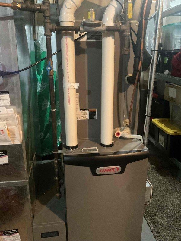 Performed scheduled maintenance agreement tune-up on Lennox Elite air conditioning system. Inspected both outdoor condensing unit and indoor air handler, finding a heavily soiled air filter restricting airflow. Replaced dirty filter with new unit to restore proper system airflow and efficiency, completing all preventive maintenance checklist items per agreement terms.