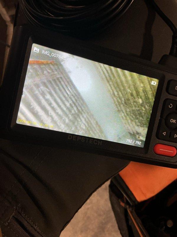 Performed maintenance on a 21-year-old R22 air conditioning system. Identified dual capacitor failure, contactor with significant pitting, and A-coil heavily contaminated with dust and debris accumulation. Replaced dirty air filter and documented internal coil condition using inspection camera. Advised customer of failing components including dual capacitor and contactor requiring replacement, as well as the need for thorough A-coil cleaning to restore proper airflow and system efficiency.