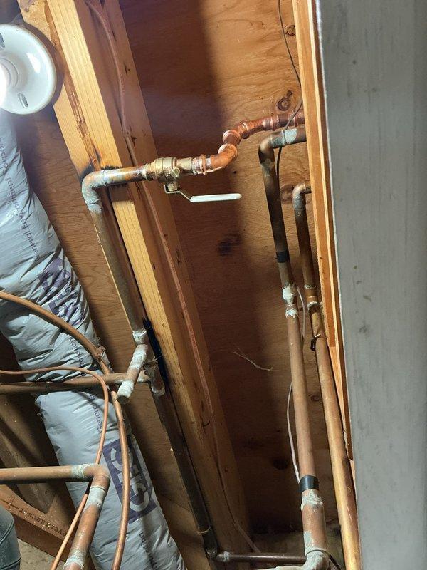 Responded to service call for leaking outdoor hose bibb and associated shut-off valve. Upon inspection, confirmed active leaks at both the interior shut-off valve and exterior hose bibb connection. Replaced both the defective shut-off valve and outdoor spigot assembly with new fixtures, utilizing copper piping connections and brass fittings to ensure proper water-tight seals. System tested and verified operational with no leaks detected.