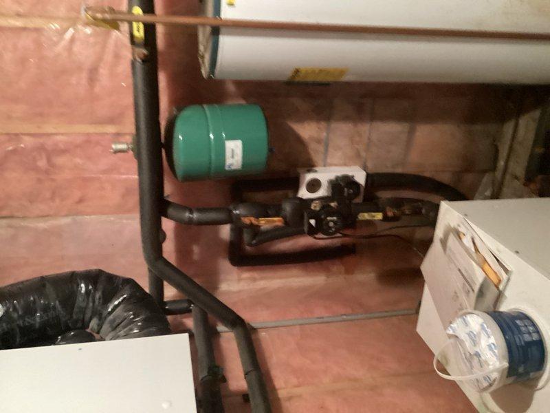 Completed comprehensive plumbing inspection of residential property as part of friends and family service. All plumbing systems, fixtures, and components were examined and found to be in good working condition. Minor corrosion was observed on several valves in the basement mechanical room, including components near the pressure tank and water distribution system. Documented existing conditions with photographs of mechanical equipment area, including pressure tank, piping connections, water heater, and HVAC components for service records.
