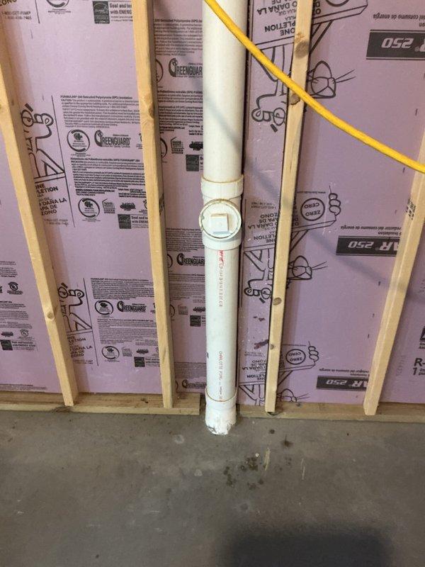 Completed comprehensive plumbing inspection of residential property. Successfully repaired malfunctioning faucet located adjacent to sauna room, restoring proper water flow and function. Documented existing water filtration and treatment system installation, including three-stage filter cartridge assembly, pressure expansion tank, and associated copper and PVC plumbing connections within exposed wall framing.