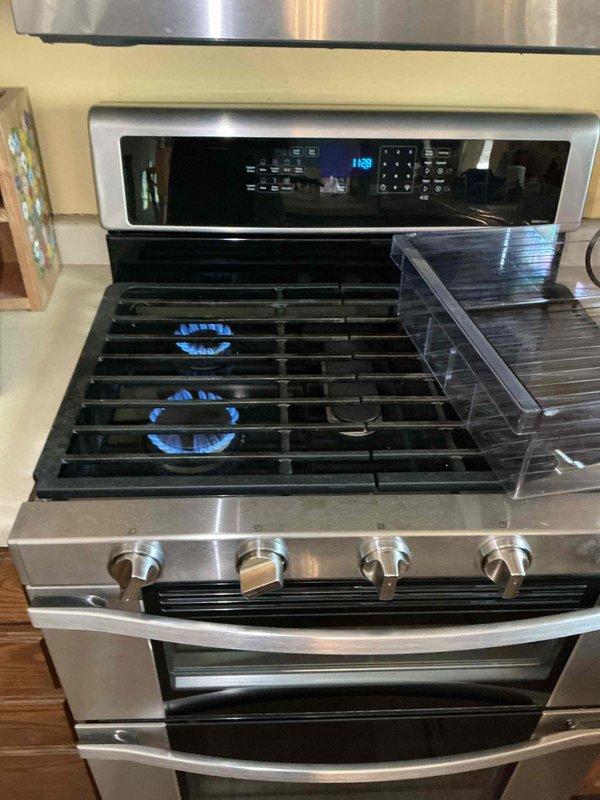 Completed refrigerator water line and icemaker hookup with proper connections verified. Leveled and adjusted gas range to ensure proper positioning against wall and clearance for adjacent cabinetry. Leveled dishwasher and made necessary adjustments to prevent interference with surrounding drawer operation.