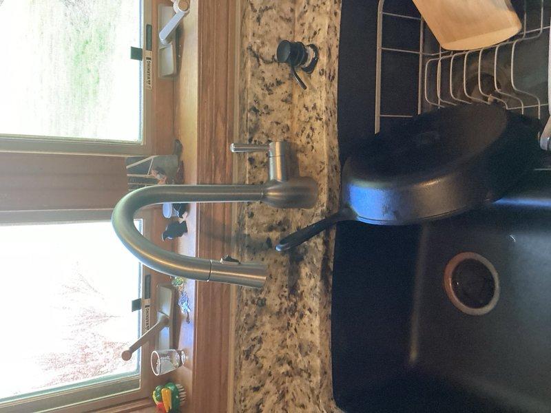 Completed comprehensive plumbing inspection for rewards member with no issues identified. Evaluated piercing valve on humidifier supply line connected to furnace, which was previously reported as non-functional during heating system inspection. Documented existing plumbing infrastructure including copper supply lines, mounting hardware, kitchen fixtures, and faucet assembly. Provided estimate for humidifier replacement with recommendation to replace piercing valve during that service to ensure proper water supply connection and system functionality.