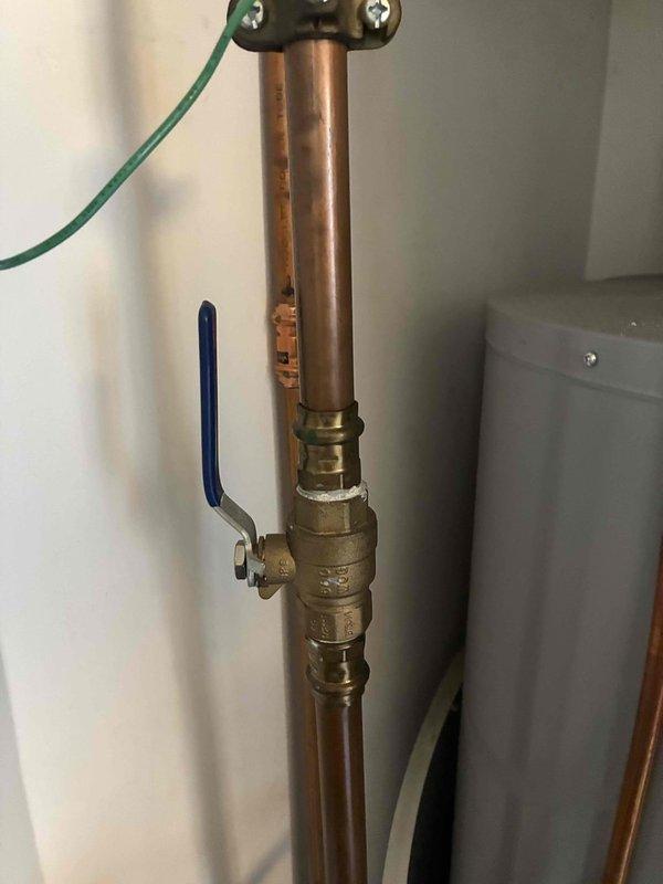 Responded to no hot water call at residential property. Found high limit intake screen on natural gas water heater completely plugged with debris, preventing proper operation. Cleared intake screen and restored hot water functionality. Inspected water heating system including water softener, copper piping, shutoff valves, and all connections to verify proper operation after repair.