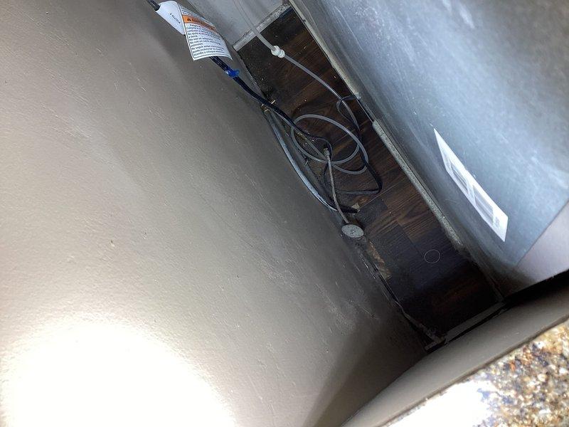 Responded to emergency water leak under kitchen sink caused by pinhole leak in 3/8" push fit supply line. Main water supply had been shut off by homeowner due to active spraying. Replaced defective stop valve and damaged section of 3/8" supply line with new components. Restored water service and verified all connections for proper operation with no leaks detected.