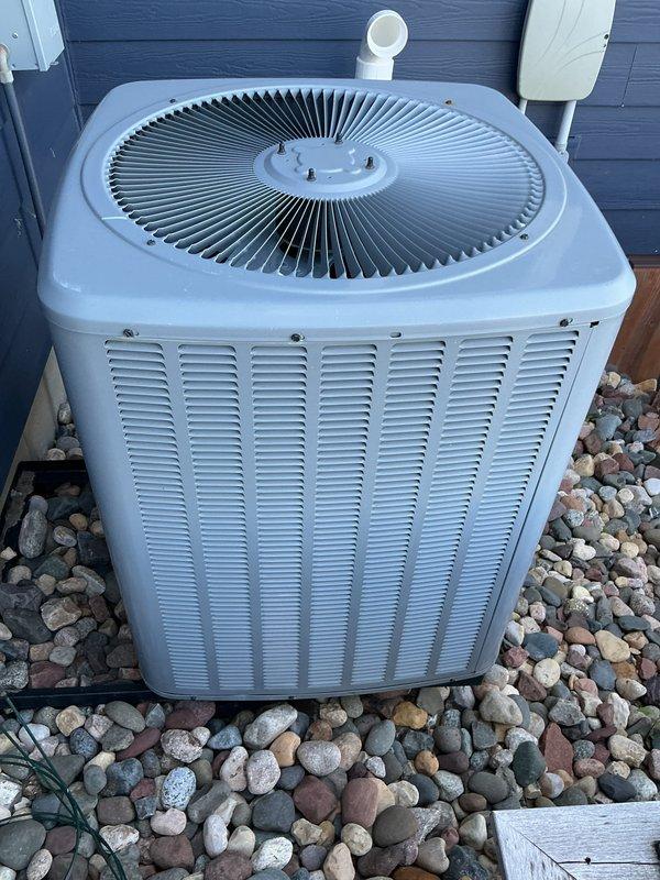 Completed annual AC maintenance tune-up on 9-year-old residential air conditioning system. Found condenser coil heavily soiled with debris; thoroughly rinsed and cleaned coil to restore proper heat transfer efficiency. Inspected air filter which was found in acceptable condition requiring no replacement. Installed hard start kit to assist compressor startup and extend equipment lifespan. Verified system operation and temperature differential readings post-service, with supply air temperature measuring 93.4°F. Unit operating normally with improved airflow through cleaned condenser coil.