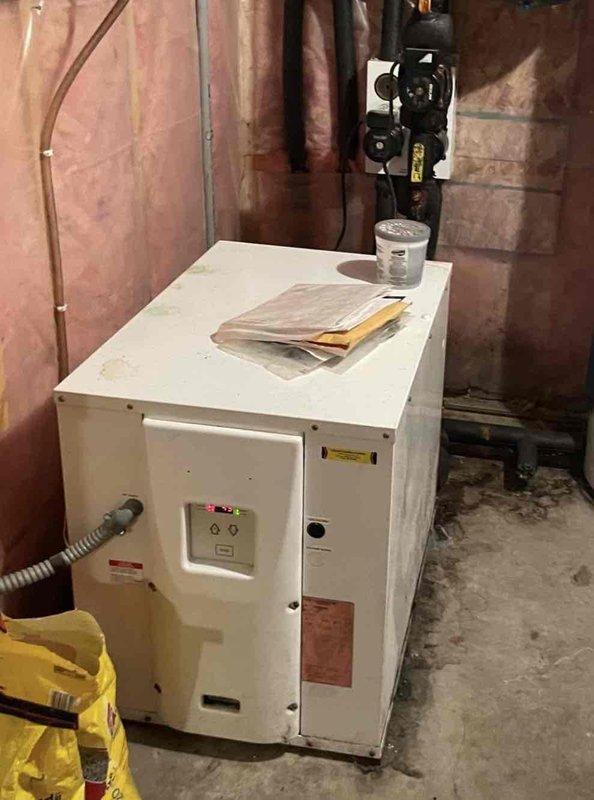 Completed comprehensive 12-4 maintenance tune-up on 20-year-old geothermal heat pump system. Performed full equipment inspection including wiping down all accessible components, testing operational functions of major system elements, and flushing the evaporator drain line to ensure proper condensate removal. Verified system operation in heating mode and confirmed radiant in-floor heating functionality, with all components operating within normal parameters.