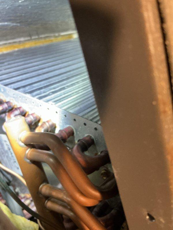 Performed comprehensive maintenance tune-up on 19-year-old R410A air conditioning system. Identified pitting contactor requiring future replacement and heavy debris accumulation on condenser coil, which was thoroughly cleaned and rinsed to restore optimal airflow and heat transfer efficiency.
