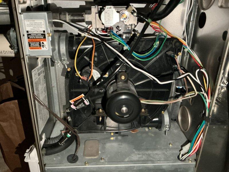 Responded to service call for furnace producing loud rattling noise. Upon inspection, diagnosed failing inducer draft motor as source of excessive noise. During examination of internal components, observed signs of potential heat exchanger leakage, though not conclusively confirmed at time of inspection. Documented findings with photographic evidence of internal mechanical assemblies, wiring configurations, and component condition. Advised that heat exchanger will likely require replacement in near future based on visual assessment. Scheduled follow-up appointment for furnace replacement estimate and will provide repair cost breakdown once pricing is obtained.