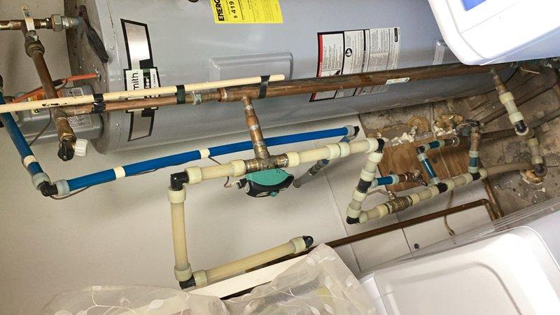 Responded to service call for central boiler system experiencing overheating condition with home temperature reaching 80+ degrees. Diagnosed malfunctioning three-way zone valve that was stuck open and failing to shut off completely, causing unintended heat bypass to the baseboard radiators from the woodstove heating system. The defective sweat valve was allowing continuous hot water circulation to the radiators regardless of thermostat settings. Provided estimate for replacement of the faulty three-way valve with new unit to restore proper zone control and prevent continued overheating. Customer approved repair work to be scheduled at next available opportunity. Documented existing plumbing configuration including mixed piping materials (copper, PEX, and CPVC) and current valve assembly with photos for reference during upcoming valve replacement.