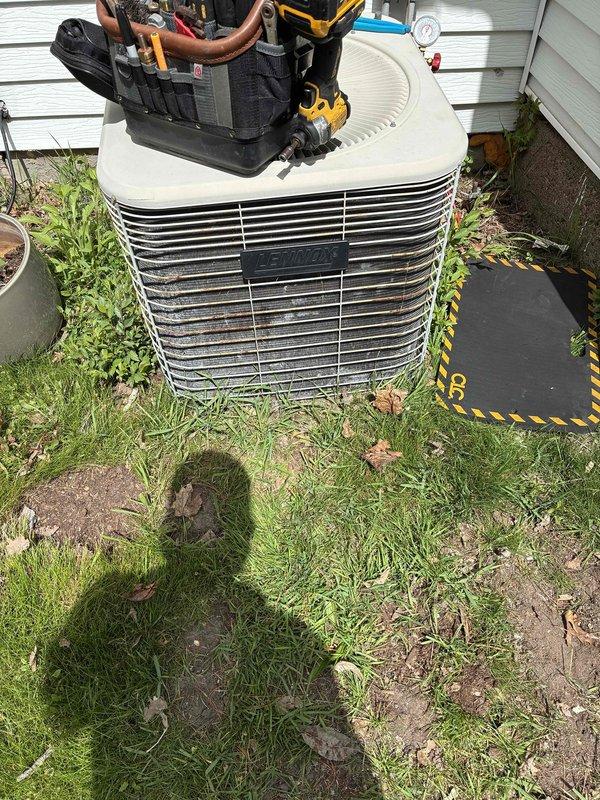 Completed preventative maintenance on 24-year-old R22 air conditioning system. Performed comprehensive AC tune-up including condenser coil cleaning, electrical measurements verification within manufacturer specifications, and installation of customer-supplied air filter. System operating properly with adequate cooling performance, appropriate refrigerant pressures for ambient conditions, and satisfactory temperature differential across evaporator coil.
