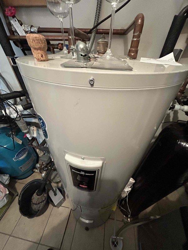 Completed Family Rewards cooling maintenance visit on Lennox air conditioning system. Performed comprehensive tune-up including hosing off outdoor coil and full system inspection. During capacitor check, discovered failed capacitor with blown top edge and oil leakage. Replaced defective capacitor under manufacturer warranty with customer approval. Verified system operation with proper 21° temperature split across evaporator coil. All remaining equipment components inspected and found to be in good working condition and functioning properly.