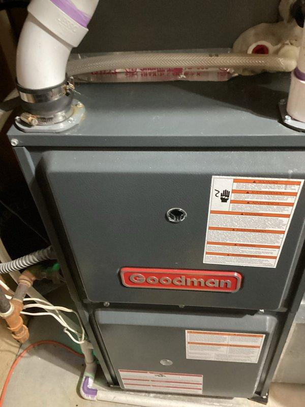 Completed routine preventative maintenance visit on a 3-year-old Goodman air conditioning system under family rewards agreement. Performed comprehensive system inspection including outdoor condenser unit evaluation, indoor evaporator coil assessment, and furnace cabinet examination. Observed significant dust and debris accumulation on outdoor condenser coil fins requiring attention, while indoor components and condensate drainage system with PVC piping connections appeared properly installed and functioning. System operational with no reported issues at time of service.