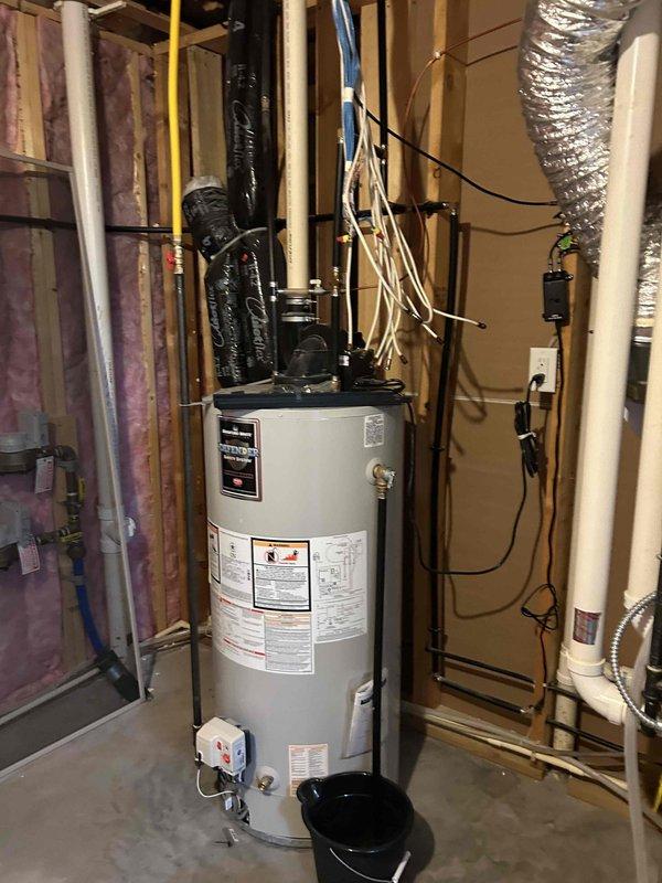 Replaced variable speed combustion inducer assembly on residential furnace. The new inducer was an updated version that created a clearance issue with the pressure switch under the ECM housing. Removed and repositioned mounting brackets and insulated exposed terminals to achieve proper fit. Verified furnace ignition sequence and operation upon completion.