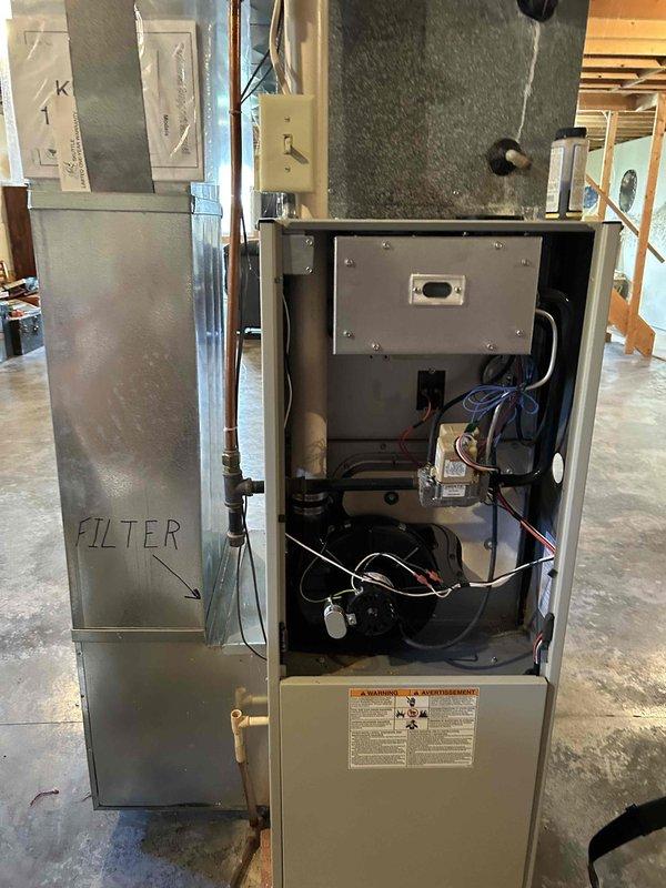 Responded to report of LP gas odor detected throughout residence, particularly near furnace area. Upon arrival, confirmed presence of gas smell at entry. Performed comprehensive leak detection inspection using soap bubble solution on all gas fittings at furnace and gas stove locations with no leaks identified. Utilized combustible gas detector to test all gas connections and fittings throughout home with no positive readings on meter. Conducted combustion analysis test on 20+ year old LP furnace unit, which passed with acceptable readings. Gas odor dissipated during course of inspection. Advised homeowner to ventilate residence and contact gas utility provider if odor returns. No leaks detected at time of service call.