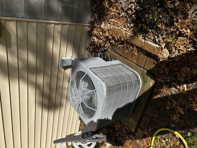 Completed annual air conditioning maintenance visit as part of recurring membership service. Performed system operational check despite cold ambient temperatures, replaced air filter, cleared condensate drain line, and pressure-washed outdoor condenser coil. Inspected all major components and identified thermostat wire routing to outdoor unit showing minor wear to insulation jacket with no exposed copper currently visible; recommended monitoring for potential future replacement to prevent communication issues between indoor and outdoor units.