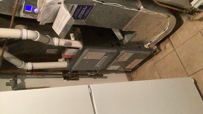 Responded to service call for a 3-year-old Bradford White 40-gallon natural gas water heater displaying a solid red indicator light and not producing hot water. Upon arrival, found the unit in the off position with the pilot light extinguished. Relit the pilot light and turned the gas valve to the on position to engage the main burner. The burner ignited properly and maintained steady flame during observation. Exercised the gas valve by cycling between pilot mode and temperature settings to verify proper operation and response. Contacted Bradford White technical support to confirm diagnostic interpretation of the solid red light error code, which indicated no flame detection by the gas valve sensor. Per manufacturer recommendation, performed a gas valve reset procedure to clear any potential fault conditions. Following the reset, conducted multiple operational tests to confirm the gas valve was functioning correctly and the burner was cycling on and off as designed. Verified proper fla