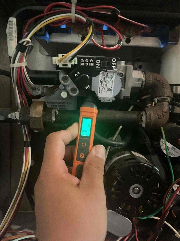 Performed comprehensive tune-up on residential furnace system at first of two scheduled locations. Conducted diagnostic testing using digital manometer to measure gas pressure and system performance parameters. Inspected gas valve assembly, verified all electrical connections, and examined blower motor operation. Evaluated overall system condition and determined unit replacement recommended due to advanced age and declining efficiency. Documented equipment status with detailed photographs of internal components and diagnostic readings for customer records.