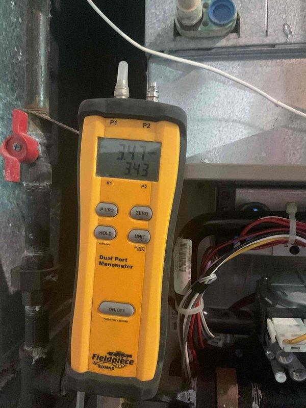 Performed comprehensive tune-up on residential furnace system at first of two scheduled locations. Conducted diagnostic testing using digital manometer to measure gas pressure and system performance parameters. Inspected gas valve assembly, verified all electrical connections, and examined blower motor operation. Evaluated overall system condition and determined unit replacement recommended due to advanced age and declining efficiency. Documented equipment status with detailed photographs of internal components and diagnostic readings for customer records.