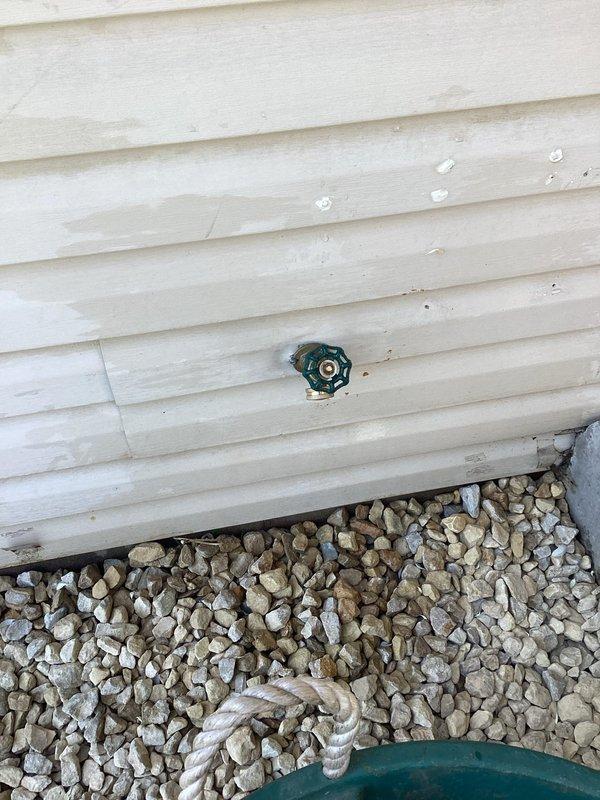Responded to service call for malfunctioning exterior hose bib with continuous water dripping. Inspected outdoor spigot and identified failed shut-off valve preventing complete water flow closure. Provided customer with replacement quote for new frost-free sillcock assembly and shut-off valve repair to resolve the leak issue.