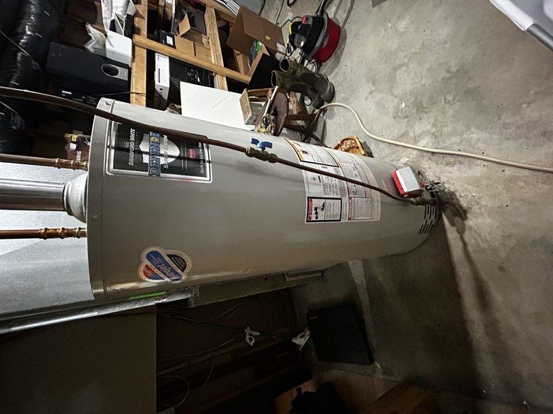 Responded to no heat call on 1994 Lennox propane furnace. Upon arrival, found pilot would ignite but main burner would not light, with igniter sparking continuously for approximately 30 seconds before system shutdown. Removed pilot assembly and thoroughly cleaned spark rod, flame sensor, and verified pilot tube was clear of obstructions. Reinstalled pilot assembly and tested system operation—unit now igniting properly and heating as designed. Performed visual inspection of heat exchanger with no condemnable cracks observed.