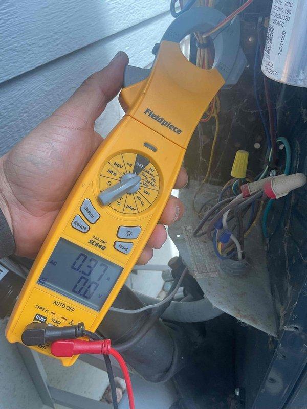 Completed annual cooling system maintenance and tune-up on air conditioning unit. Performed comprehensive electrical diagnostics using digital multimeter, measuring voltage and amperage readings to verify proper system operation. All components tested within normal operating parameters with no issues identified; system operating efficiently.
