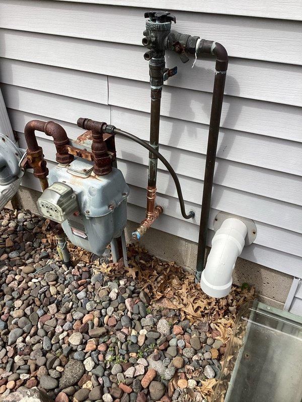Responded to callback for leaking irrigation ball valve installed 4-5 months prior. Upon inspection, identified leak at first 90-degree elbow fitting immediately after the valve assembly. Since installation was within the one-year warranty period, accessed the through-wall piping system via ceiling cavity and replaced the defective 90-degree copper fitting and associated connections. Resoldered joints to ensure watertight seal and verified system integrity upon completion.