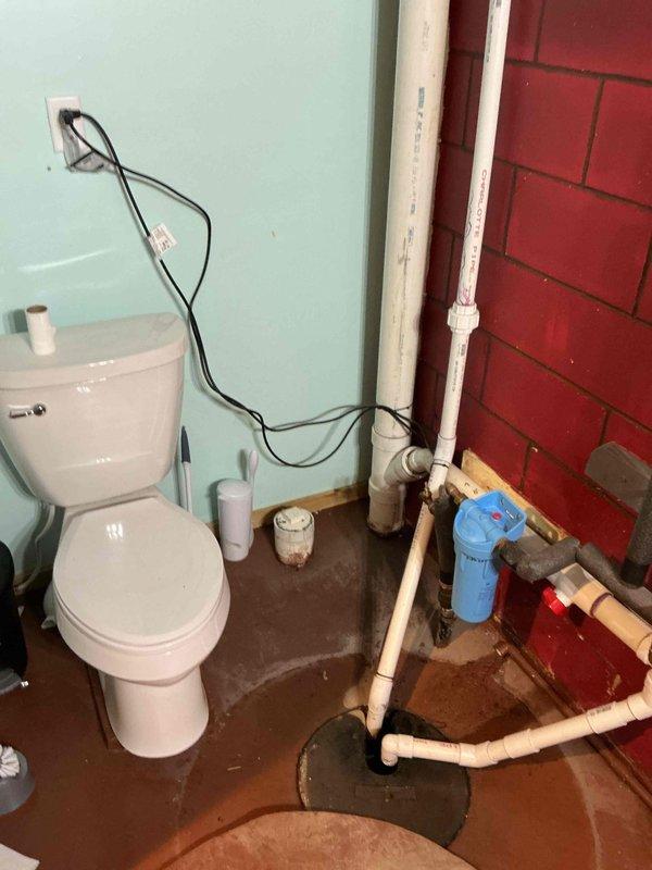 Responded to flooding issue in basement bathroom occurring during washer operation. Upon inspection, determined the gray water pump serving the washer and dryer was not functioning. Identified that the pump had become unplugged from its electrical source. Restored power to the pump by reconnecting to outlet, resolving the drainage issue and preventing future flooding during laundry cycles.
