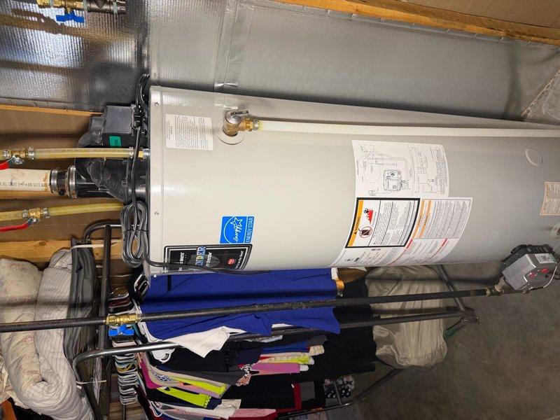 Completed comprehensive plumbing inspection of residential property including evaluation of PVC drainage system infrastructure in crawl space and water heater installation in utility area. All plumbing components, pipe connections, support structures, and water heater operation were visually inspected and documented with photographs for record-keeping purposes.