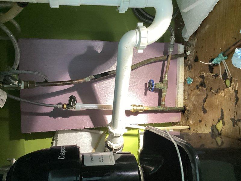 Responded to plumbing emergency involving a failed hot water shutoff valve supplying the kitchen faucet. Upon arrival, shut off the main water supply to the home to prevent further water damage. Removed the defective shutoff valve located below the kitchen sink and installed a new replacement shutoff valve on the hot side supply line. Restored water service and verified proper operation with no leaks detected at the connection points.