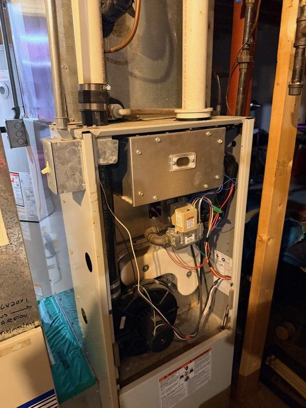 Responded to service call for furnace making excessive noise that started same morning. Upon inspection, diagnosed failing inducer motor with worn bearings causing abnormal operational sounds. Verified issue through system observation and audible assessment of component operation. Documented equipment model information and current condition with photographs for parts research and replacement options.