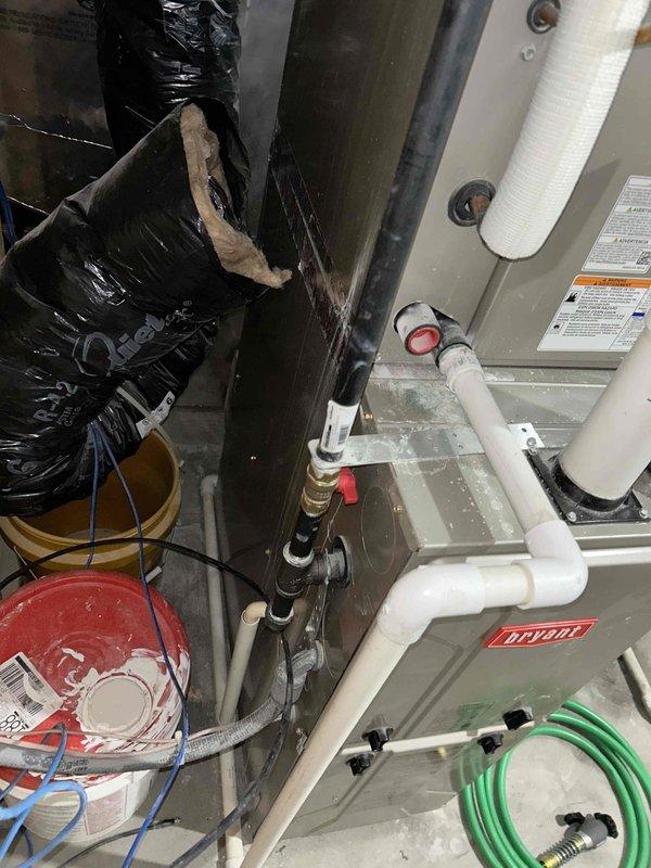 Responded to report of gas odor in basement near furnace. Upon arrival, conducted thorough investigation and identified gas leak at burner orifices. Inspection revealed that while orifices were properly seated, the gas valve was failing to close completely, allowing gas to pass through the manifold and escape from all three burner orifices. Utilized gas detection equipment to confirm active leakage and performed comprehensive safety check of all surrounding fittings, joints, and valve body connections to rule out additional external leak points. No other leaks were detected at this time. Due to safety hazard, immediately shut off gas supply to the unit, placing heating system out of service until necessary repairs can be completed. Documented findings with photographs showing equipment location and valve assembly. Parts request submitted to determine warranty eligibility and obtain replacement gas valve specifications.