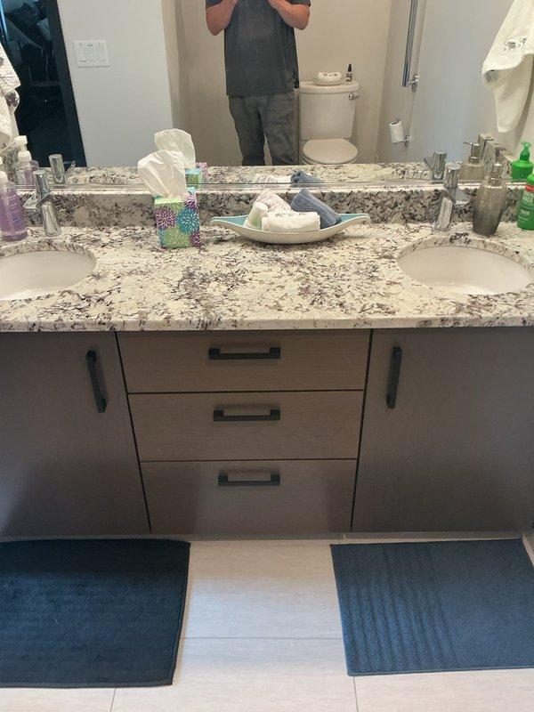 Completed biannual plumbing inspection at residential property. Performed comprehensive assessment of all plumbing fixtures, including bathroom vanity with double sink configuration and kitchen sink area. All fixtures, faucets, drainage systems, and supply lines found to be in excellent working condition with no leaks, corrosion, or deficiencies noted. Property is 8 years old and plumbing systems are well-maintained and functioning properly.