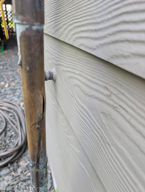 Responded to exterior irrigation system water leak caused by winter freeze damage. Upon inspection, identified failed shut-off valve that was bypassing and not completely sealing, which allowed water to leak through the system during winter months, resulting in a burst copper riser pipe. Replaced defective ball valve with new unit to ensure proper shut-off capability. Repaired damaged copper riser pipe section on exterior of building. Tested system for proper operation and verified complete seal at shut-off valve with no further leakage detected.