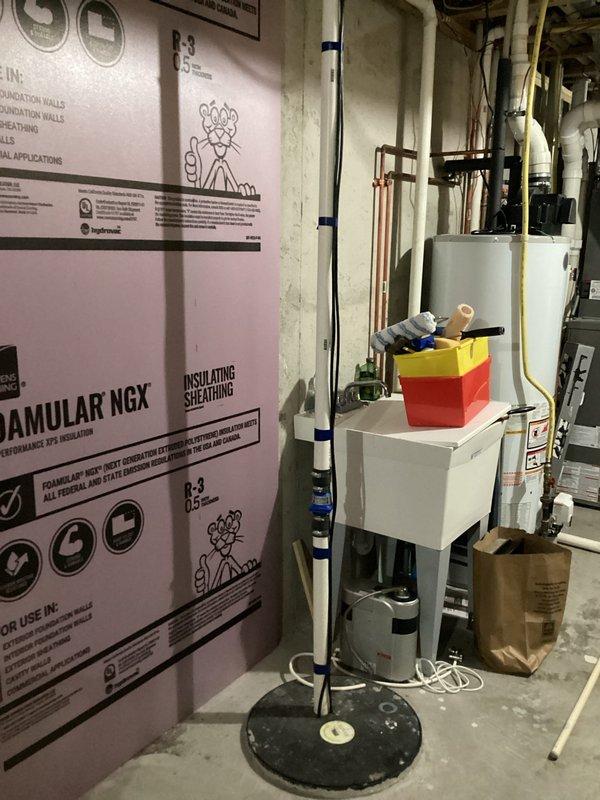 Completed comprehensive plumbing inspection of residential water heating system, including evaluation of dual water heater installation, copper supply and distribution piping, pressure relief valves, and associated connections. Documented existing equipment conditions with photographic evidence showing proper mounting, piping configuration, and functional components in basement mechanical room.