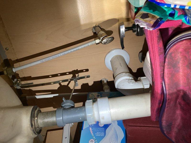 Completed comprehensive plumbing inspection revealing excessive water pressure at 90 PSI on supply lines and a leaking laundry tub faucet requiring attention. Documented conditions with photographs and prepared estimates for installation of a pressure reducing valve to bring system pressure within safe operating parameters and replacement of the defective laundry tub faucet to eliminate water waste.
